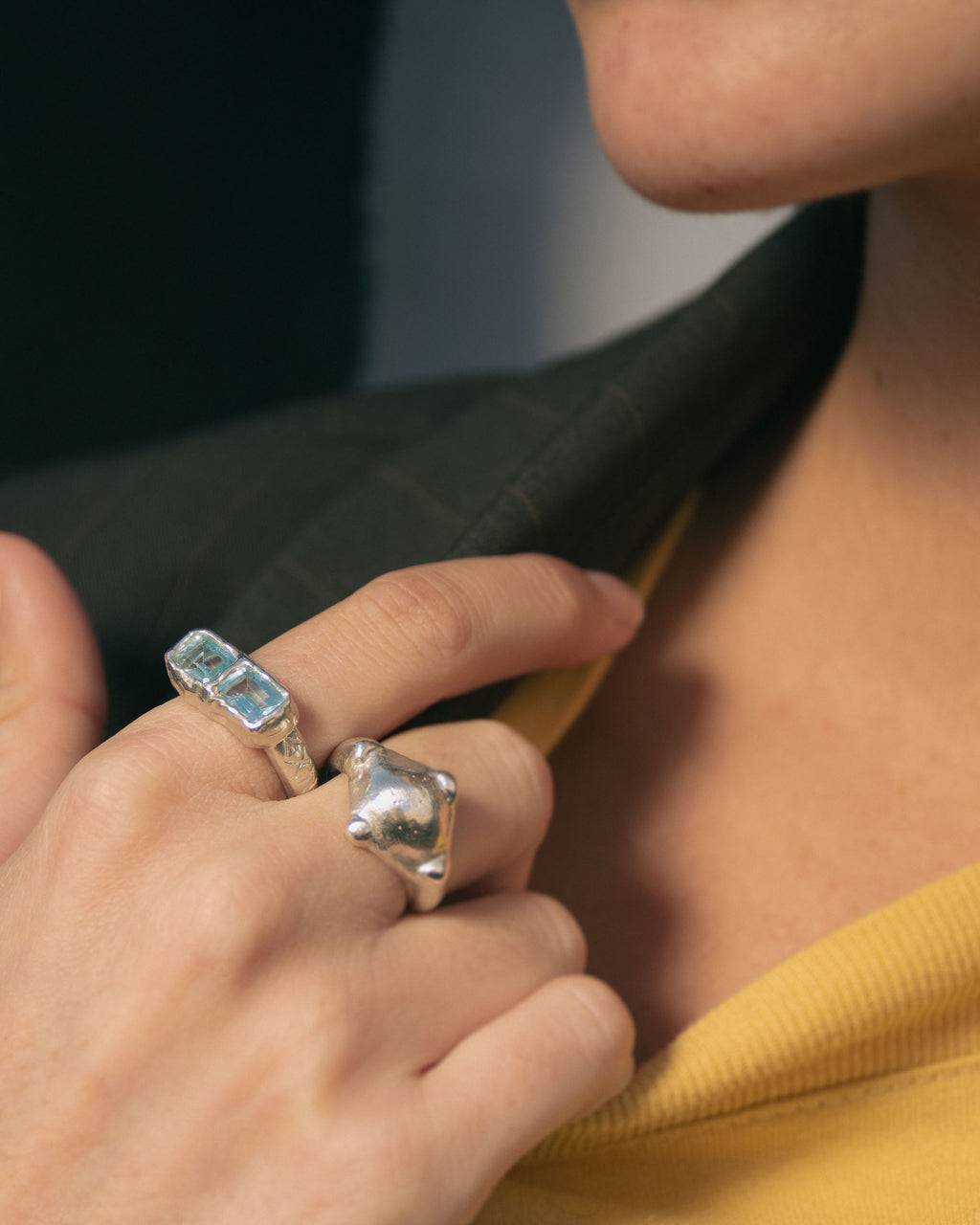 Silver ring with sky blue topaz and silver ring with a compass shape