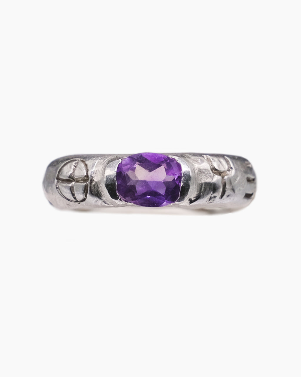 Silver ring with an african amethyst stone in the center and engravings front view