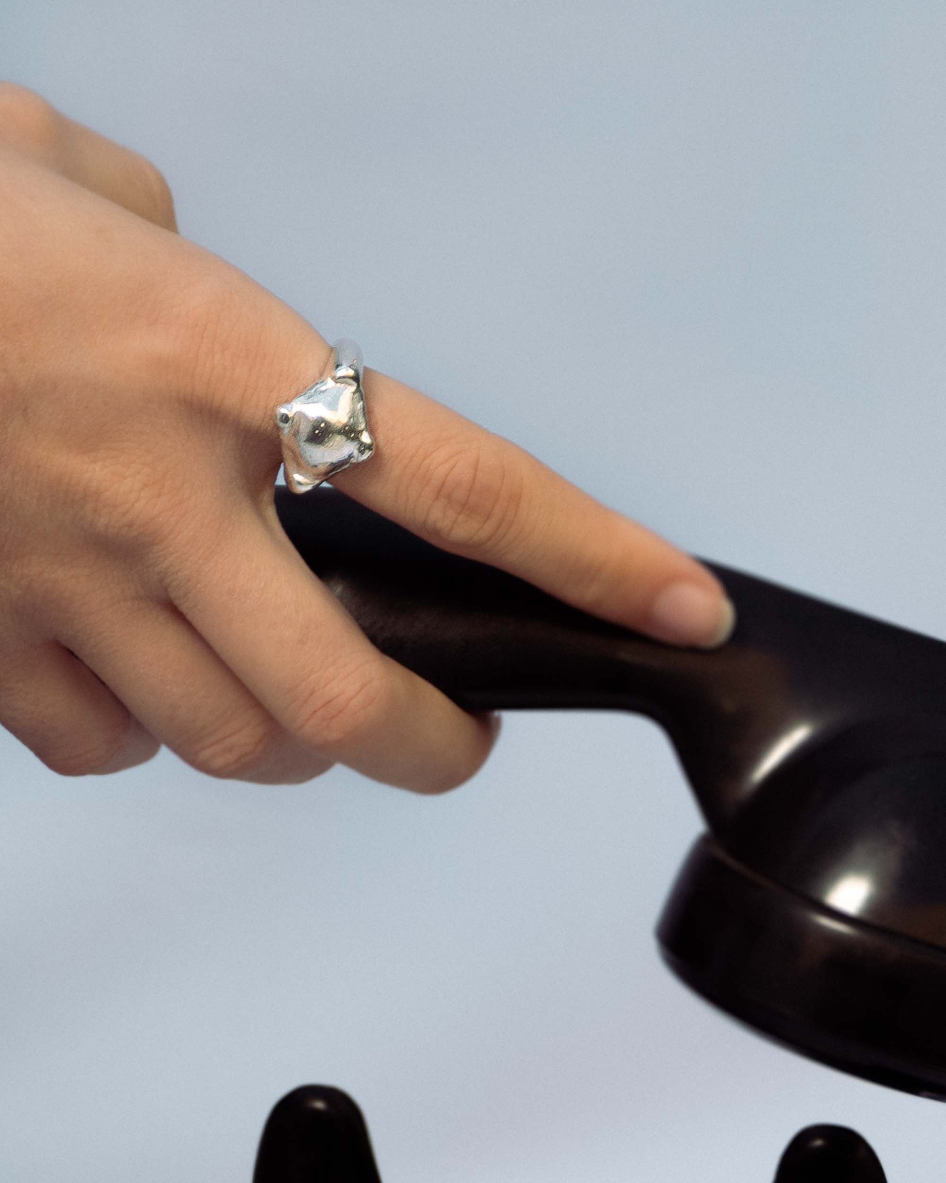 Silver ring with a compass shape