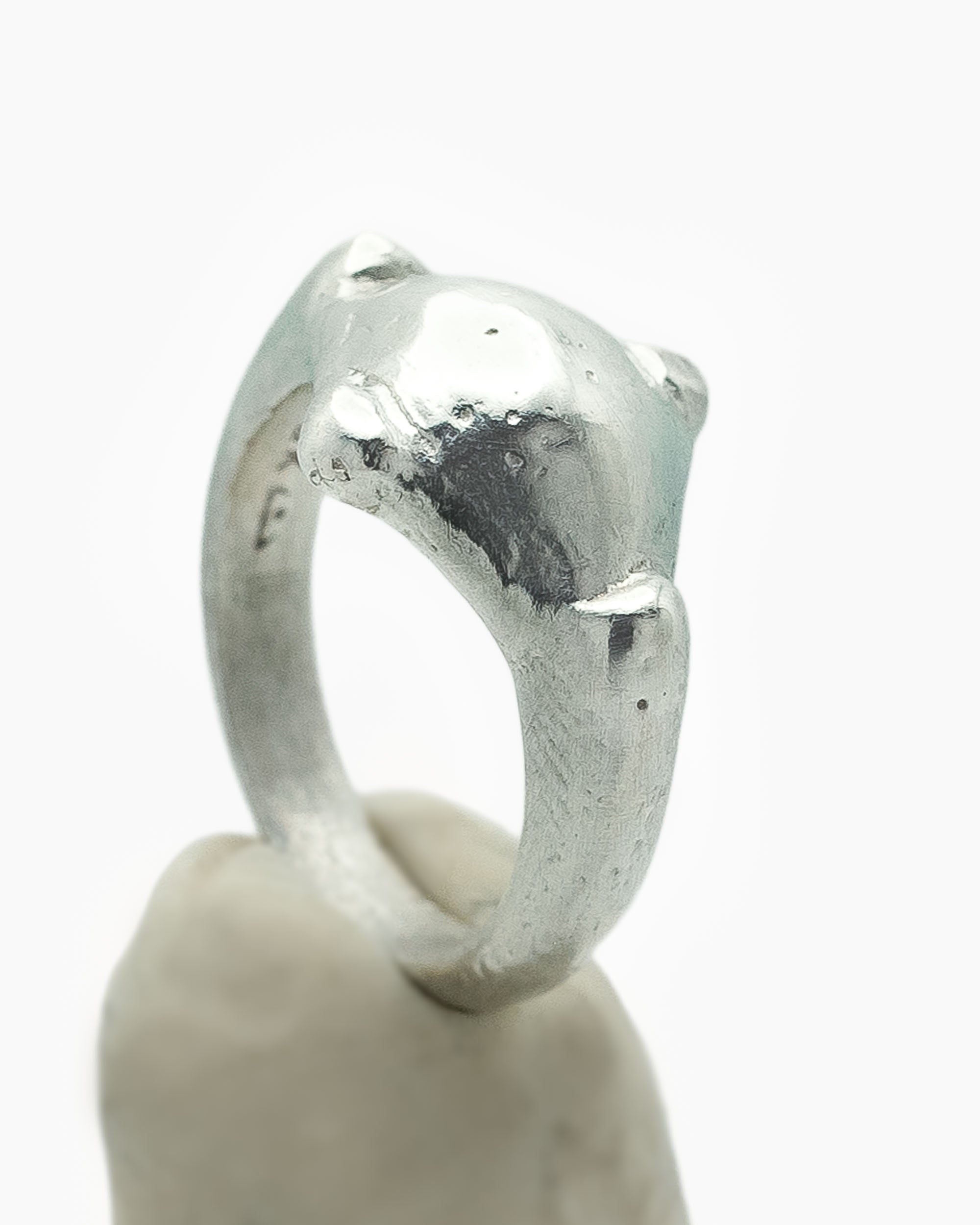 Silver ring with compass shape